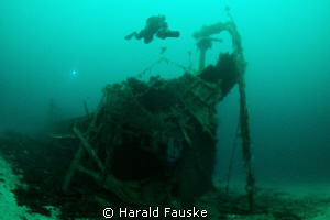 Diver over the stern of "Hilda" sunk  in 1875, now restin... by Harald Fauske 